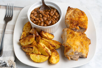 seasoned chicken thighs  with  baked beans