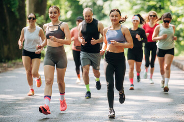 Obraz premium Marathon conception, front view. Group of runners are together outdoors