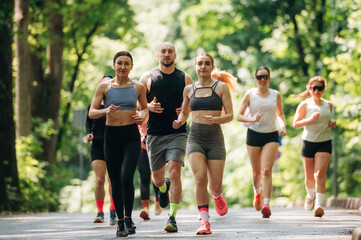 Obraz premium Training and jogging. Group of runners are together outdoors