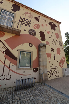 Castelo Branco/Portugal - July 31 2025: Artistic and historical elements displayed on the exterior walls of Quartel da Devesa