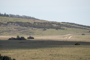 Obraz premium British army Warrior FV510 IFV tanks in action on a military exercise