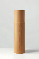 A cylindrical wooden bottle with a smooth cap and slightly darker body, standing upright on a white background.