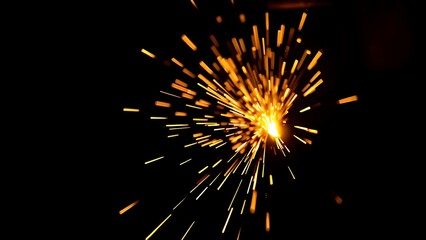 A close-up of glowing sparks against a dark background, capturing the intensity of industrial metalworking.