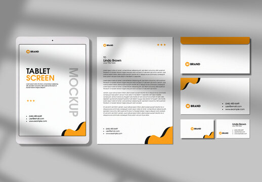 Top View of Stationery Set and Tablet Mockup