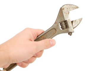 Old Metal Spanner in Human Hand Isolated on White Background