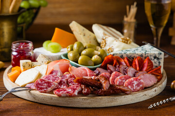 Meat and cheese board. A mix of exquisite cheeses and cold cuts from many countries.