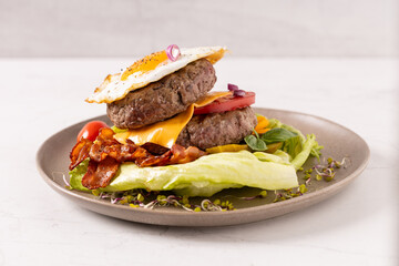 Beef burger without a bun with a fried egg