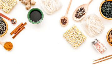Rice vermicelli, noodles, spices, weeds pattern to cook Chinese, Japanese food on white background top view copy space