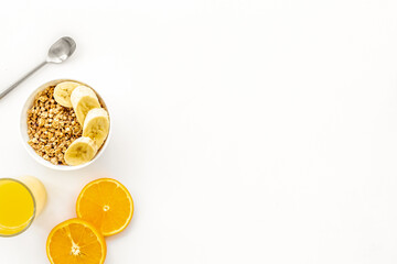 Bright breakfast with granola and orange juice on white background top view mockup