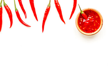 Cooking hot food with chilli pepper on white table background top view copy space
