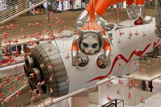 TOKYO, JAPAN - August 12, 2025: Detail of the installation 'Big Cat Bang' including a model of a cat and many smaller ones in Ginza Six shopping mall. It was created by by Kenji Yanobe. 