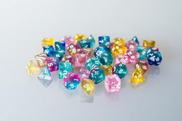 different colours dices for fantasy dnd and rpg tabletop games. Board game polyhedral dices with different sides isolated on white background