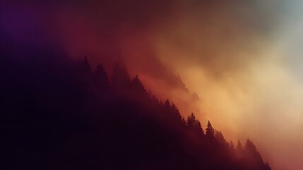 Misty mountain silhouettes against a gradient sky.