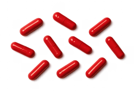 Red pills arranged on transparent background forming diagonal lines