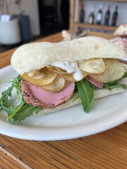 Delicious sandwich filled with fresh ingredients like crisp vegetables, tender meats, and savory spreads, all between two slices of soft bread. Perfect for a quick and satisfying meal.