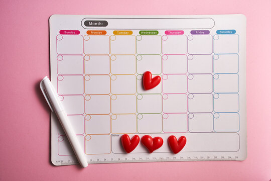 magnet monthly planner with marker pen and heart shape.