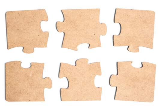 Collection of various pieces of puzzle on white background.