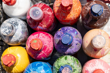 A lot of colorful bottles ready for painting