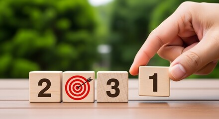 New year goals planning concept setting up wooden blocks for year twenty twenty one