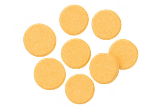 Orange vitamin or supplement pills forming a diamond shape on transparent background