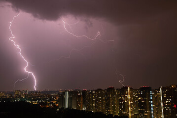 thunderstorm and lightning over the night city
