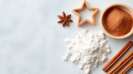 Baking spices and flour arranged on a light surface with star-shaped cookie cutter and cinnamon sticks.