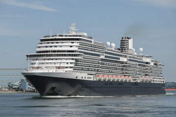 Modern luxury cruiseship cruise ship liner Koningsdam, Nieuw Statendam or Rotterdam departure sail away from Vancouver BC port, Canada for Alaska cruise with breathtaking nature landscape scenery