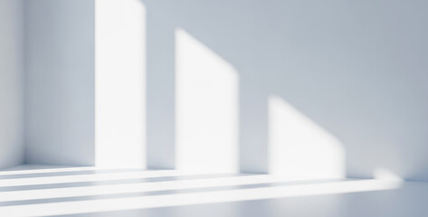 White room corner with sunlight casting shadows creating abstract patterns, producing a serene and artistic atmosphere for minimalist architectural interiors.