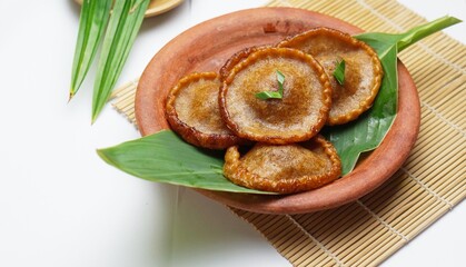 Kue Kucur or Kucur or kuih cucur is a traditional snack. Kue cucur on white background