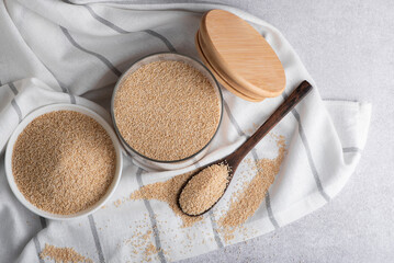 Raw organic amaranth grain. Amaranth seeds in a bowl on wooden table.	