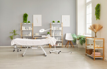 Room interior of beautician and cosmetologist salon for beauty spa treatment, facial skin therapy, massage. Modern cosmetic dermatology clinic with furniture and equipment. Cosmetology concept