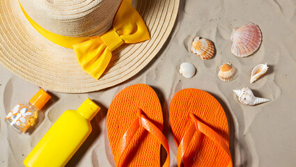 Beach essentials hat flip flops sunscreen and seashells on sand