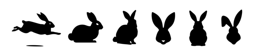 Silhouettes of several running rabbits.
