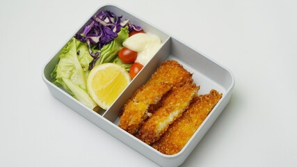 lunch boxes with food ready to go for work or school, bento, dori katsu with salad