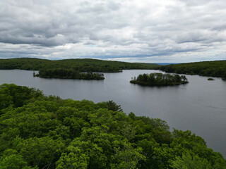 Fototapeta premium lake tiorati view in harriman state park nature landscape hiking beautiful landscape with dramatic cloudy sky tiny island in pond camping camp hike trek outdoor adventure travel tourism