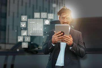 Business professional using tablet for digital planning in urban setting during summer