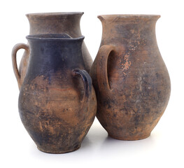 Ancient clay jugs isolated on white background