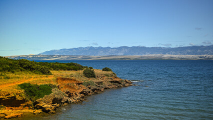 Obraz premium Scenic view of the croatian coastline with the velebit mountain range in the background, showcasing the natural beauty of the adriatic sea