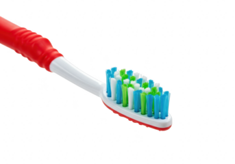 Red toothbrush with colorful bristles isolated on transparent background