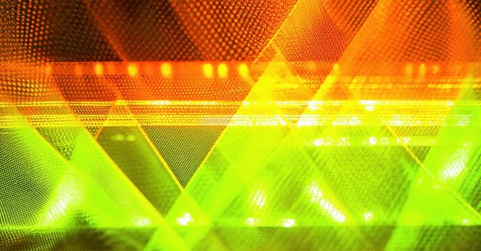 Bright abstract background. Geometric shapes overlap, creating vibrant orange, yellow, green gradients. Texture resembles illuminated grid.
