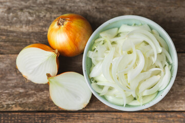 Onion on the kitchen table. onion slice. onion rings. Fresh Yellow Onion. Natural, fresh, vegetarian food. Agricultural products. Healthy eating. Vegetables. Farmer's market. Space for text.Copy space