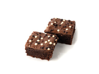 Chocolate brownie cake sprinkled with white and dark balls, classic birthday brownie square piece
