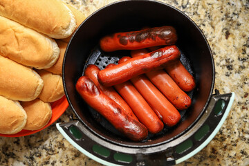 Hotdogs cooked inside of a air fryer