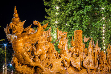 Buddhist Lent tradition, a beautiful display of wisdom, beeswax candles create art as a Buddhist...