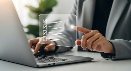 Woman checking off items on a digital checklist on laptop