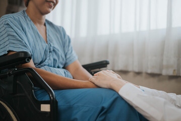 Obraz premium Close up of hand professionals doctor holding to helping and support patient. Female doctor and cancer patient hands to support together. Healthcare for the patient concept.