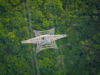 Aerial view of high voltage electricity tower on mountain