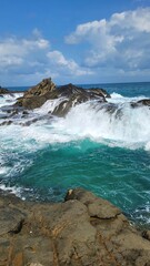 waves crashing on rocks