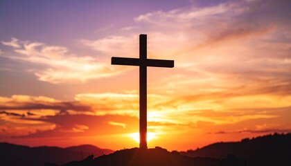 Silhouette of a wooden cross stands tall against a vibrant sunset, casting a powerful religious symbol.