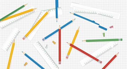 Artistic arrangement of colored pencils and rulers on a gridded background, perfect for creative projects and educational settings.